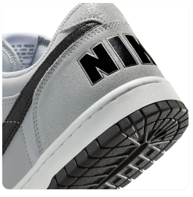 Nike Light Grey Low-Top Sneakers with Black Swoosh and Oversized Heel Branding
