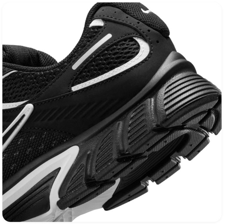 Nike Black and Silver Low-Top Sneakers with Sculpted Sole