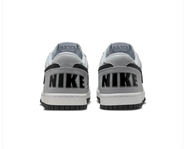Nike Light Grey Low-Top Sneakers with Black Swoosh and Oversized Heel Branding